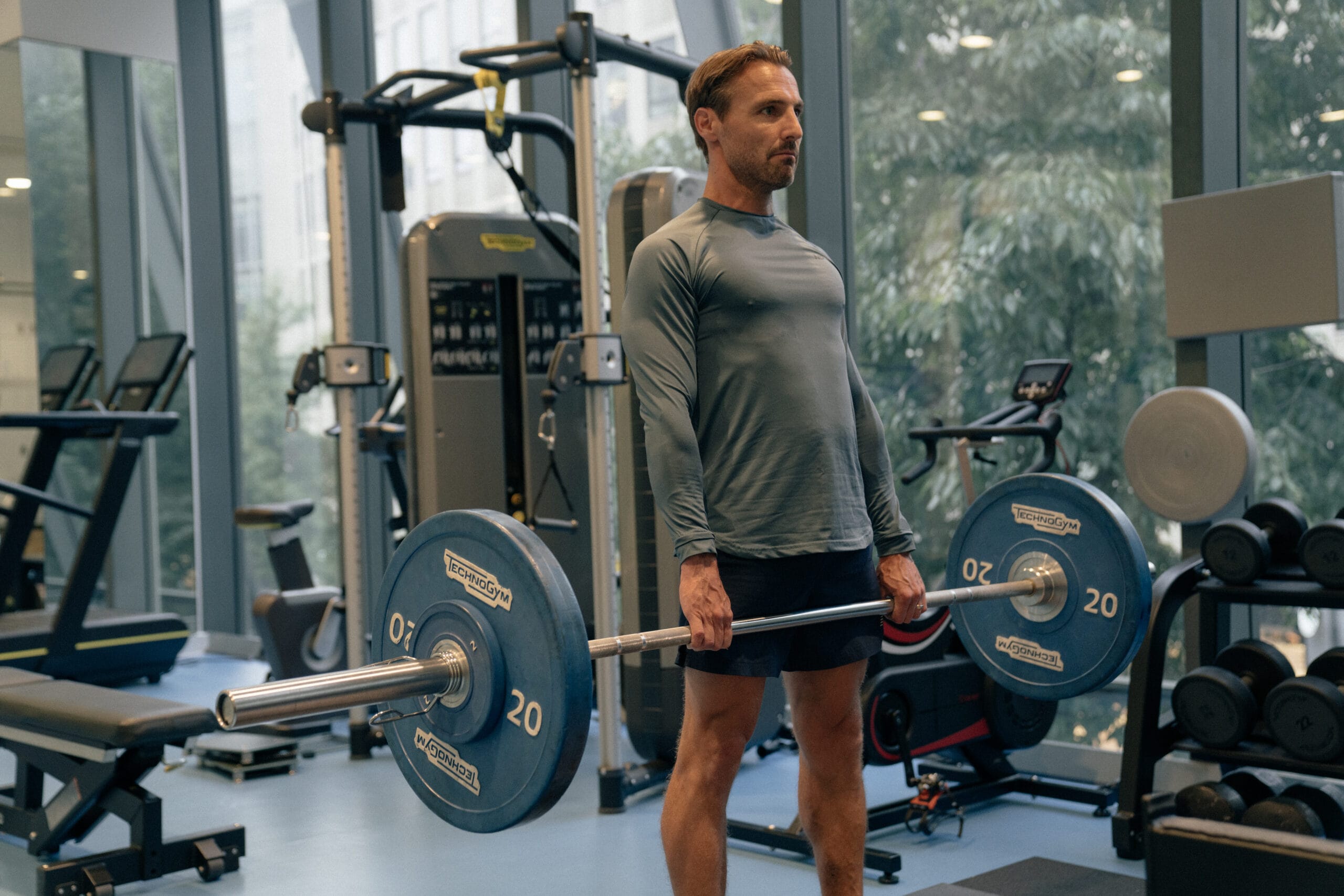 man holding weight in gym