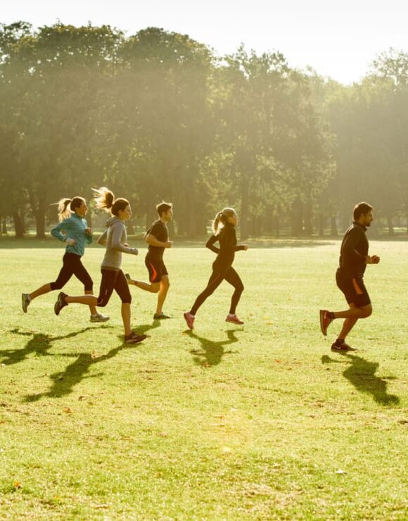 group of people jogging outside